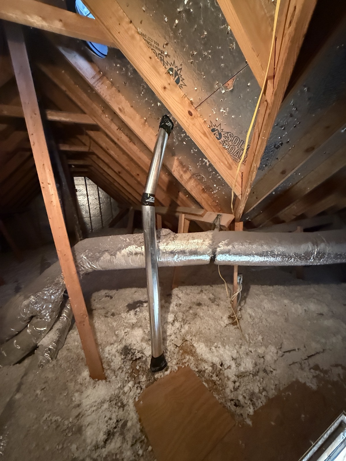 New rigid metal dryer vent run installed through an attic